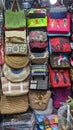 Ho Chi Minh City, Vietnam - Colorful souvenir bags for sale at a stall inside Ben Thanh Market