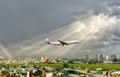 China Airlines Boeing 747 Cargo fly over urban areas with rainbow behind sky prepare landing Tan Son Nhat International Airport