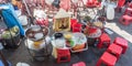 Ho Chi Minh City, Vietnam: a vendor sits by plates with ingredients for sam bo luong, a cold sweet soup