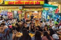 Ho Chi Minh City, Vietnam: Vietnamese people at open air restaurant at night in Bui Vien Street