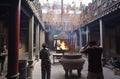 Ho Chi Minh City, Vietnam: visitors and worshipers in front of ritual fire in Thien Hau Pagoda in Cho Lon Royalty Free Stock Photo