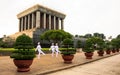 Ho Chi Minh mausoleum with white uniform soldiers marching in front to patrol the area Royalty Free Stock Photo