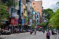 Ho Chi Minh, Vietnam - 30 Jul 2019: City street with narrow building and citizen. Urban lifestyle of modern South Asia