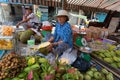 HO CHI MINH, VIETNAM - JUNE 10, 2015: An unidentified woman peels and sells durian fruit Royalty Free Stock Photo