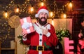 Ho Ho Ho. happy new year. Xmas present box. christmas gift delivery. bearded man santa hat. winter shopping sales Royalty Free Stock Photo