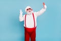 Ho-ho-ho. Portrait of overweight style funny hipster santa claus blogger in cap hat take selfie on cellphone make v Royalty Free Stock Photo