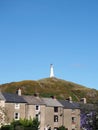 Hoad hill and historic 19th century monument in Ulverston with surrounding town houses