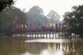 Hoan Kiem Lake Hanoi Vietnam 20/12/2013 red Huc Bridge with flags and people