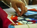 HOANG TAN, VIETNAM - JUNE 27, 2017: close up of trees being created with cross stitch at hong ngoc handicraft center