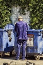 Hoarder grandfather looking in the trash useful things Royalty Free Stock Photo