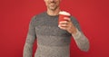 hoary man drinking coffee. male fashion model hold cup. winter fashion. morning coffee.