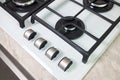 Hob cooker stove oven made of white glass grill stainless steel control knobs selective focus over out of focus oven Royalty Free Stock Photo