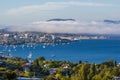 Hobart city and derwent river viewed from suburb of sandy bay with sea mist rolling over eastern shore Royalty Free Stock Photo