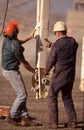 Two male workers wearing hard hats