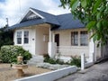 View of the front yard of a white weatherboard house Royalty Free Stock Photo