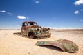 Close up of an old, rusty car wreck in the Namibian desert Royalty Free Stock Photo