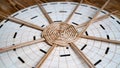 Hobbies and craft concept. Initial process weaving of circle bottom of a basket of tubes twisted from paper. Wicker