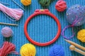 Hobby concept. Embroidery frame, colorful balls of wool, knitting needles, accessories. Copy space Royalty Free Stock Photo