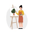 Hobby concept, girl draws on an easel