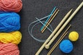 Colorful yarn, different knitting needles and crochet hooks Royalty Free Stock Photo