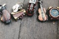 Miniature violin, clocks,travel bag and train on wooden floor Royalty Free Stock Photo