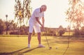 Hobby. Senior man playing golf alone. Royalty Free Stock Photo