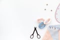 Hobby sewing with thread, scissors, fabric. Lifestyle. White background top view mock up Royalty Free Stock Photo