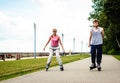 Young people casually rollblading together.