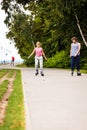 Young people casually rollblading together.