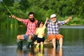 Hobby and sport activity. Happy people family have fishing and fun together. Dad and son fishing at lake. Grandpa and Royalty Free Stock Photo