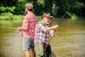 Hobby sport activity. Summer weekend. Peaceful activity. Nice catch. Rod and tackle. Father and son fishing. Fisherman Royalty Free Stock Photo