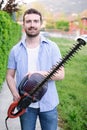 Hobbyist gardner using an hedge clipper in the home garden Royalty Free Stock Photo