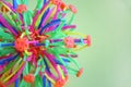 Hoberman sphere. Folding ball of rainbow colors on a light background.