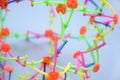 Hoberman sphere. Folding ball of rainbow colors on a light background.