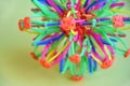 Hoberman sphere. Folding ball of rainbow colors on a light background.