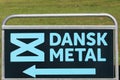 Dansk metal sign on a panel