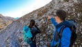 Hochschwab - A couple hiking with a mountain goat