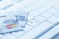 Group of credit cards on computer keyboard with VISA and MasterCard brand logos Royalty Free Stock Photo