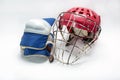 Hockey gloves,helmet and puck lay a white background isolated Royalty Free Stock Photo