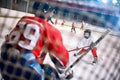 Hockey match at rink player attacks goalkeeper Royalty Free Stock Photo