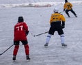 Hockey match teams fight for puck