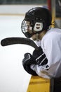 Hockey player on bench Royalty Free Stock Photo