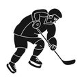 Hockey player in full gear with a stick playing hockey.Winter active sport.active sports single icon in black style