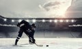 Hockey player on ice . Mixed media Royalty Free Stock Photo