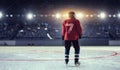 Hockey player on ice . Mixed media Royalty Free Stock Photo