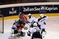 Hockey player running into goalie