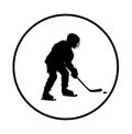 Hockey player with stick and a washer vector silhouette illustration isolated on white background. Royalty Free Stock Photo