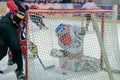 Hockey player throws the puck into the goal