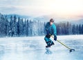 Hockey player in uniform on frozen lake