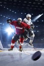 Hockey players shoots the puck and attacks Royalty Free Stock Photo